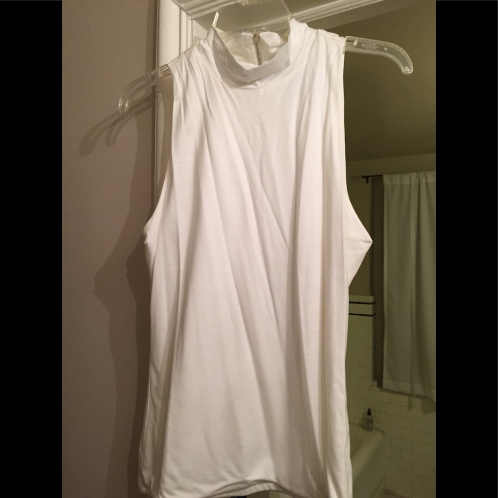 White sleeveless turtle neck. Never worn